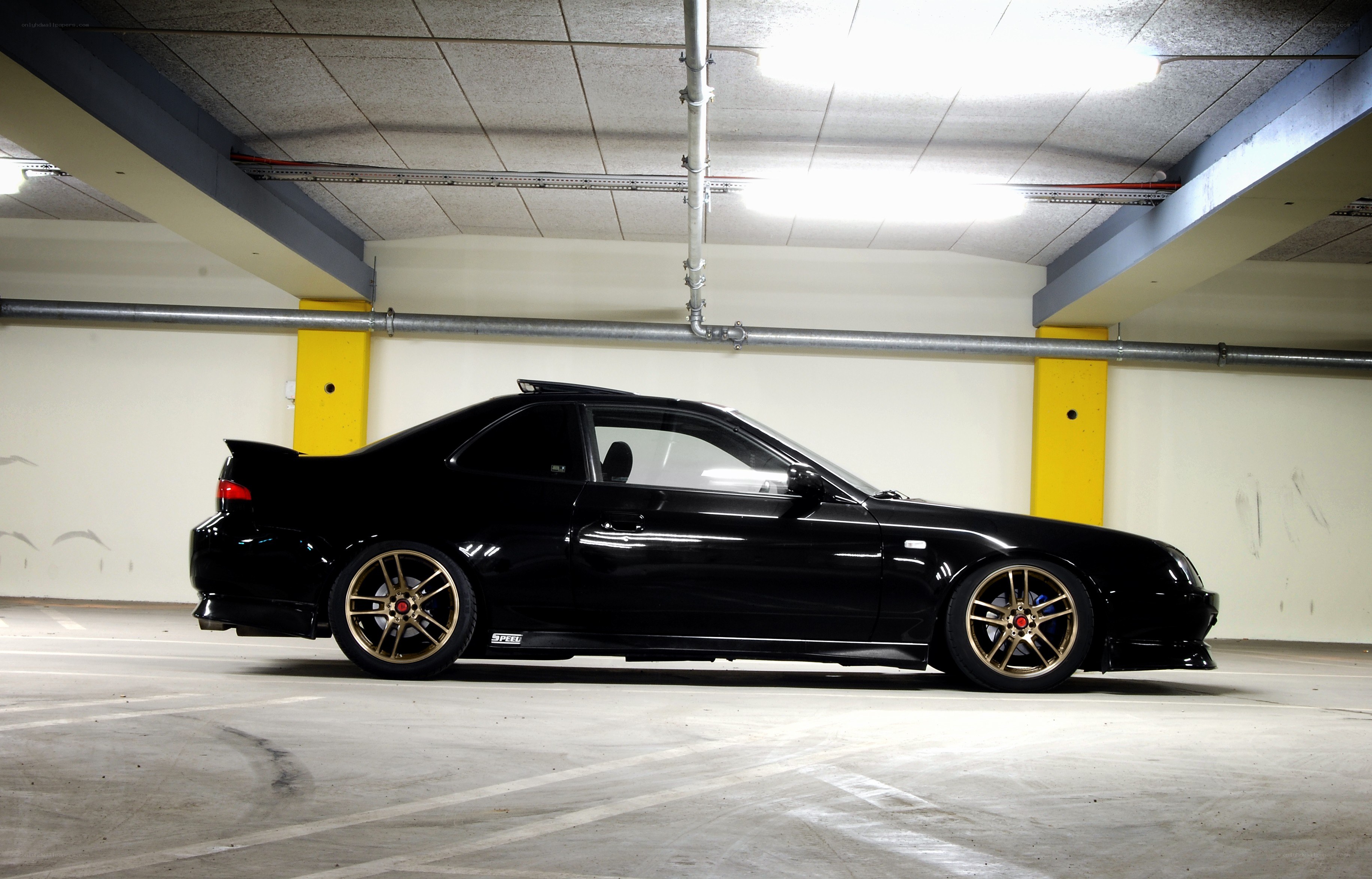 black coupe in parking garage
