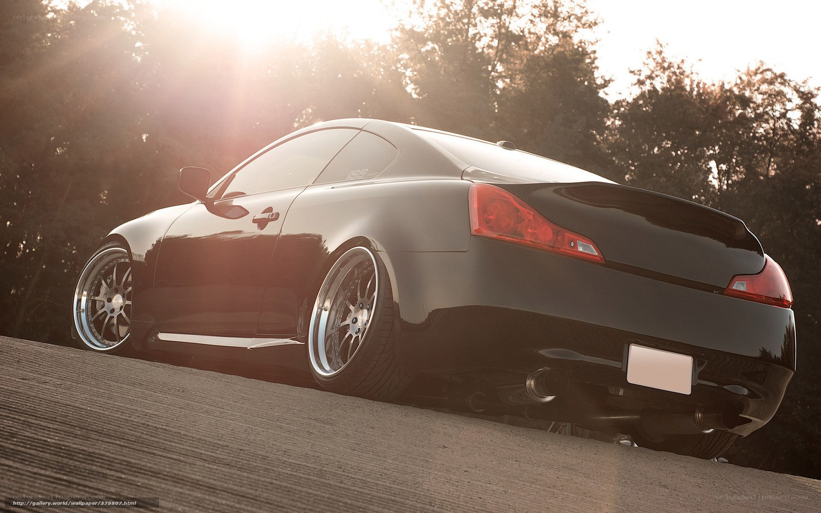 Black coupe in sunset light