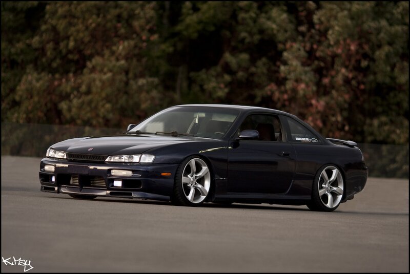 black coupe on a track