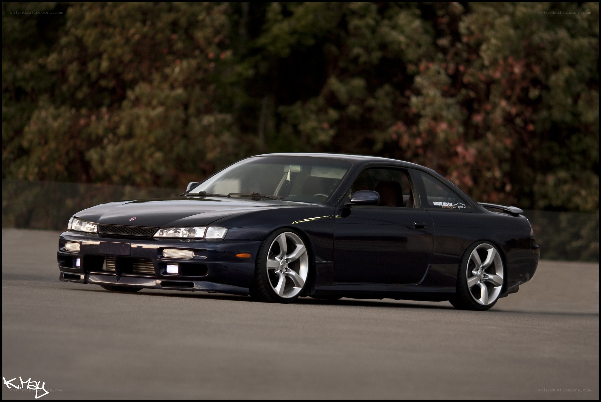 black coupe on a track