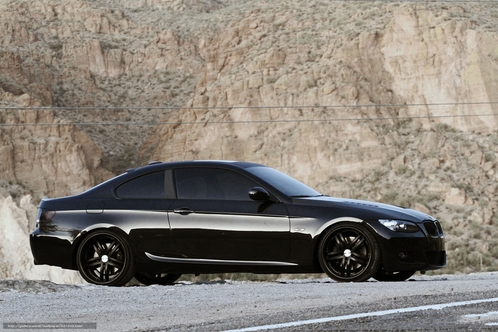 black coupe on desert road