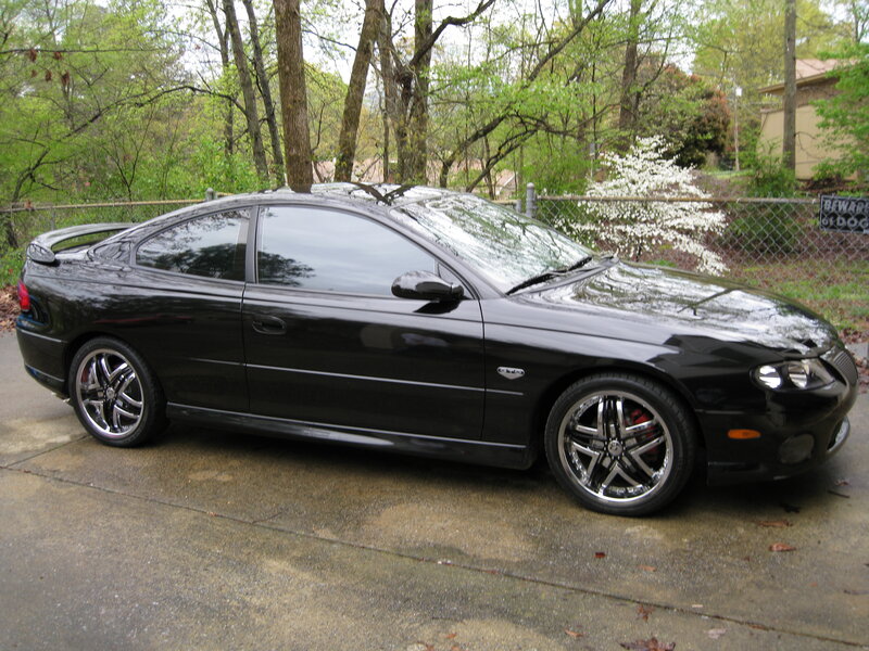 black coupe on driveway