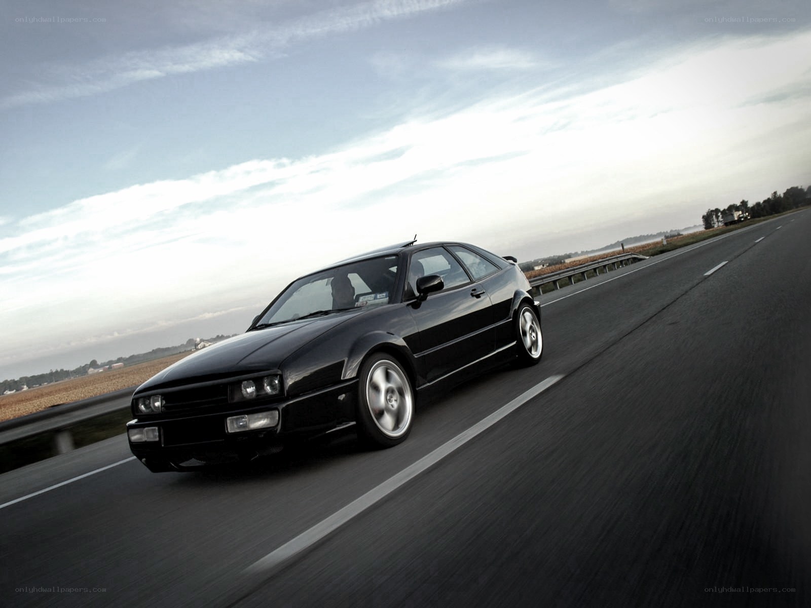 black coupe on highway