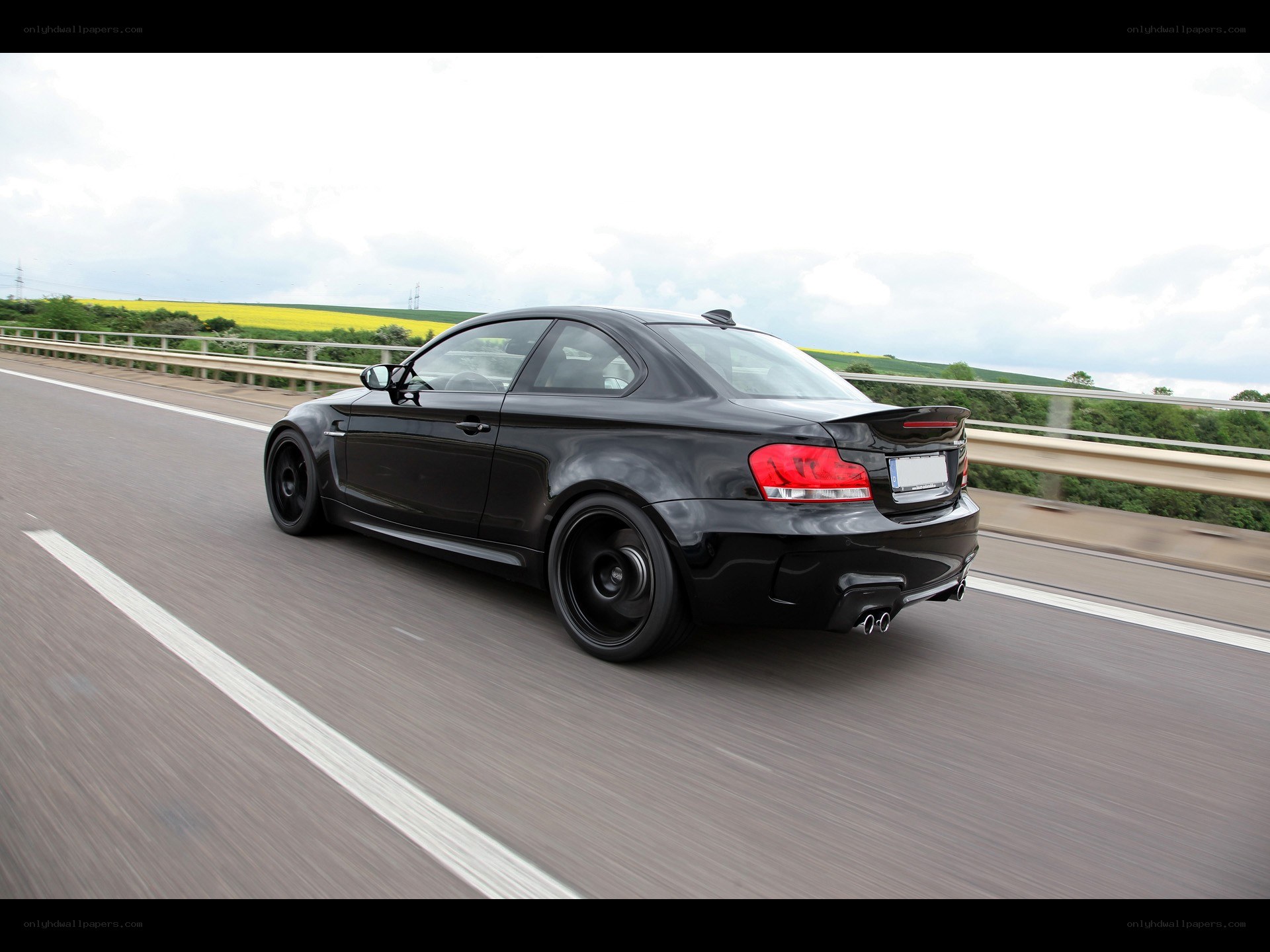 black coupe on highway