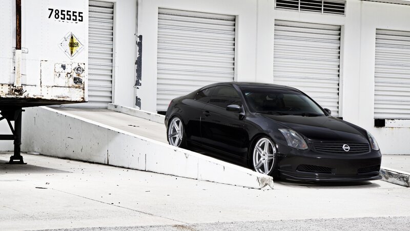 black coupe on loading ramp