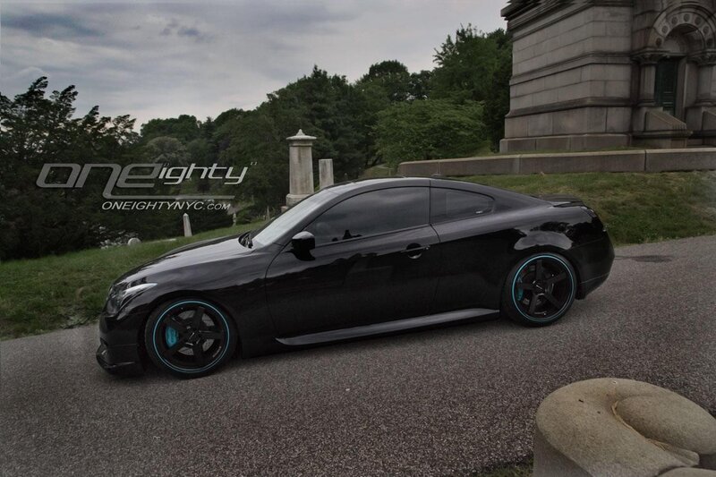 Black coupe with blue wheels