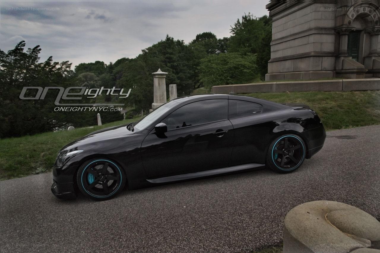 Black coupe with blue wheels