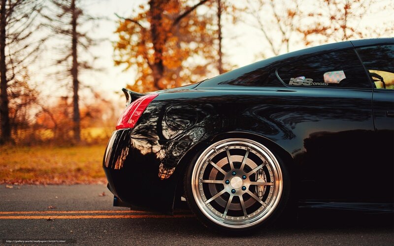 black coupe with custom wheels
