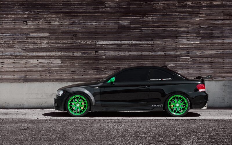 black coupe with green wheels