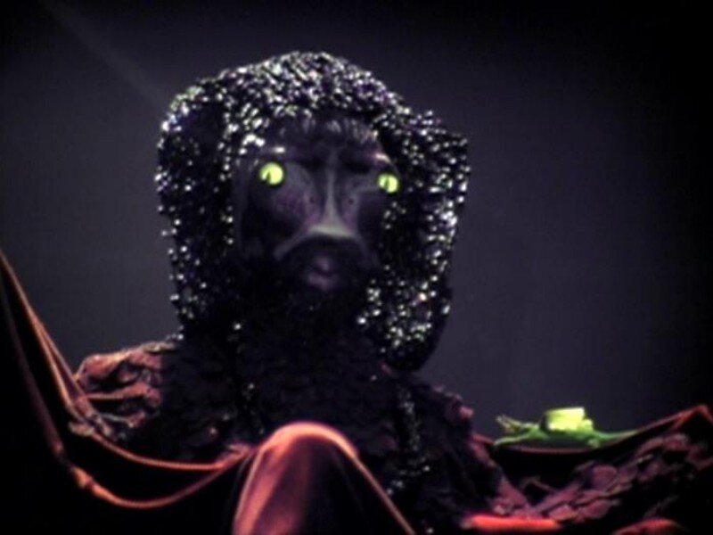 Black Creature with Glowing Eyes
