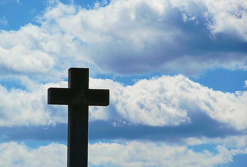 Black Cross Against Sky