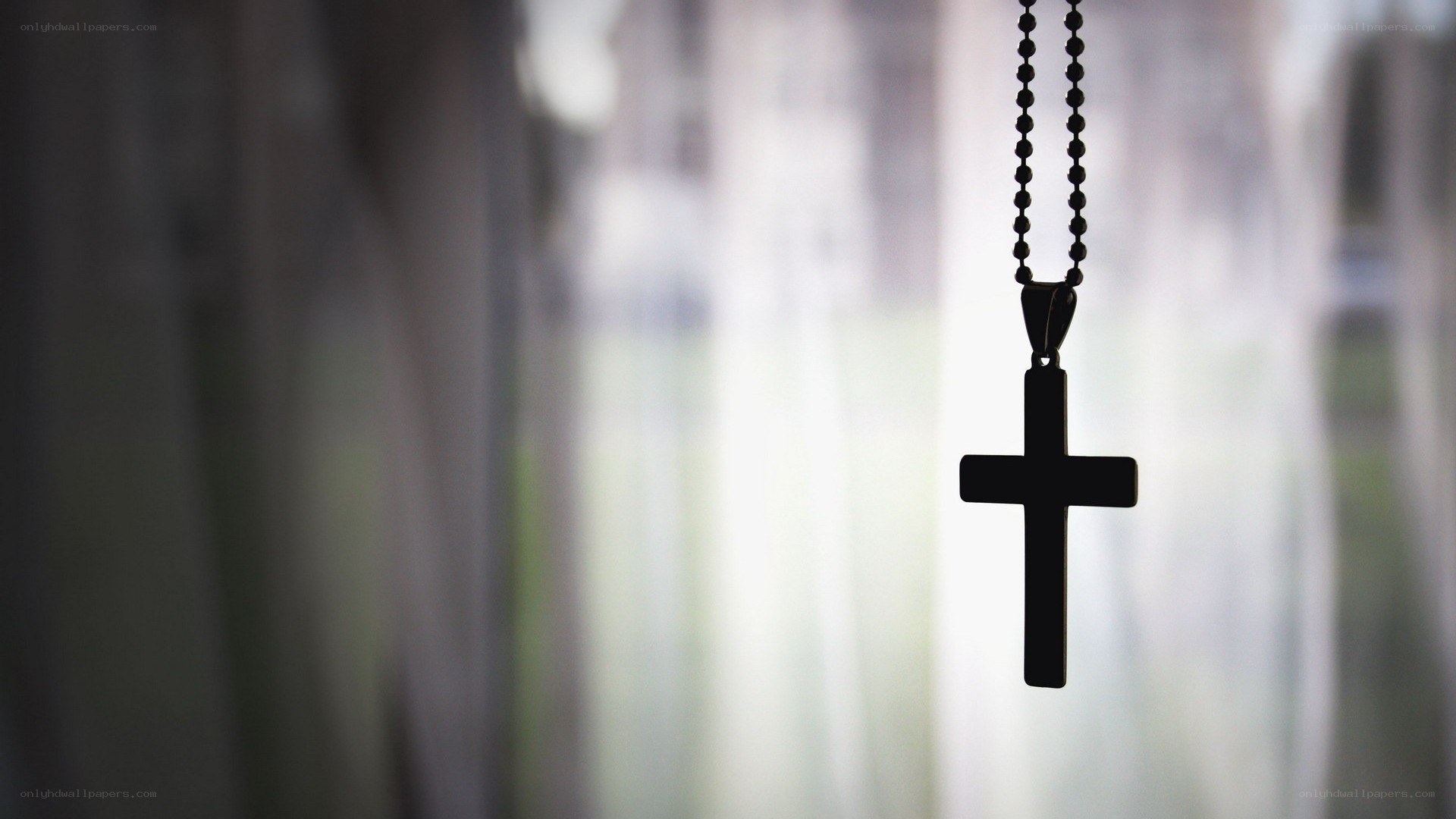black cross pendant on chain
