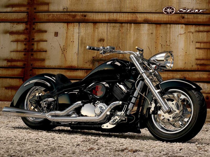 Black cruiser motorcycle on gravel