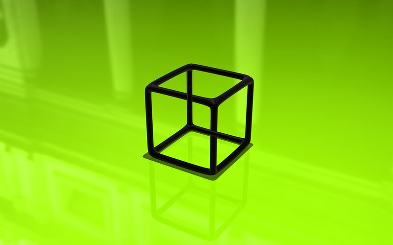 black cube on green surface