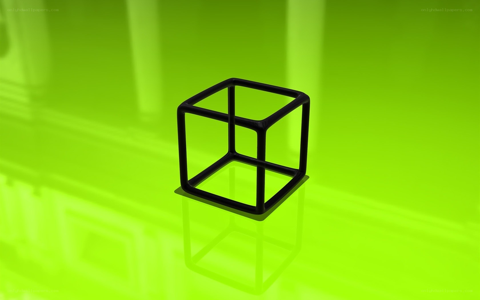black cube on green surface