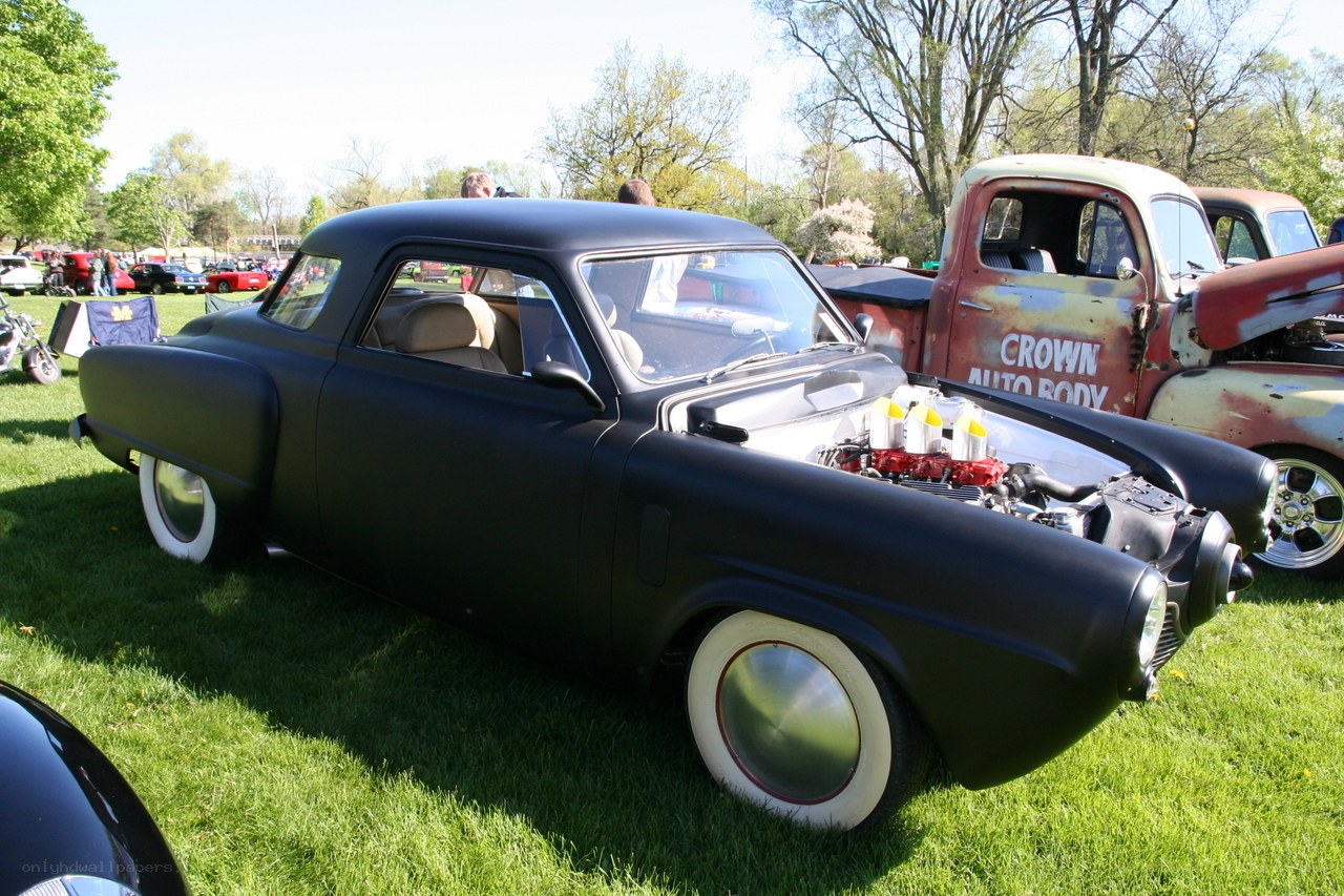 Black custom car at a show