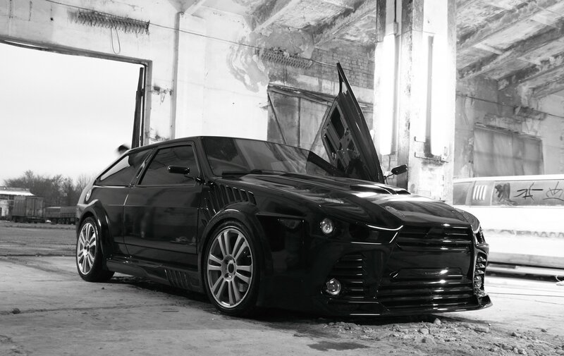Black custom car in warehouse
