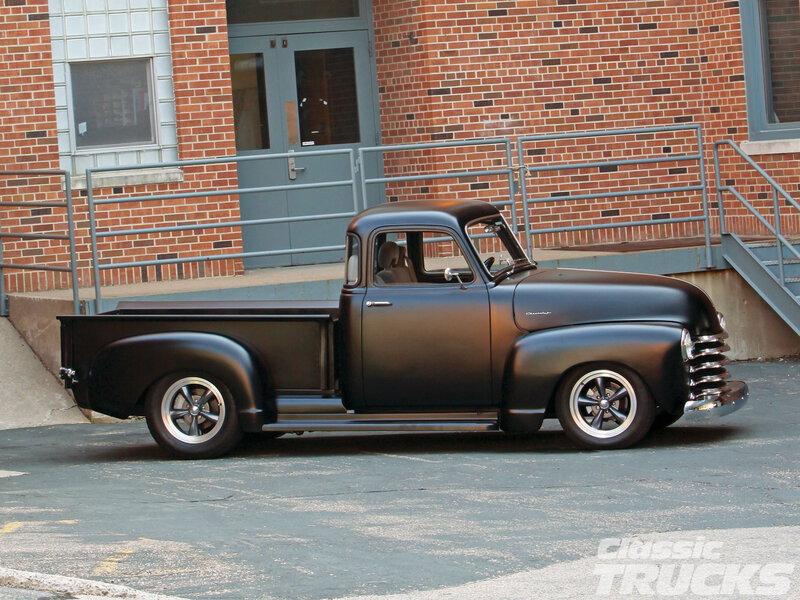 Black Custom Pickup Truck — Calm, Afternoon, Photograph, Brick Building
