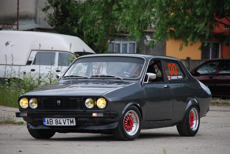 Black Dacia with red wheels