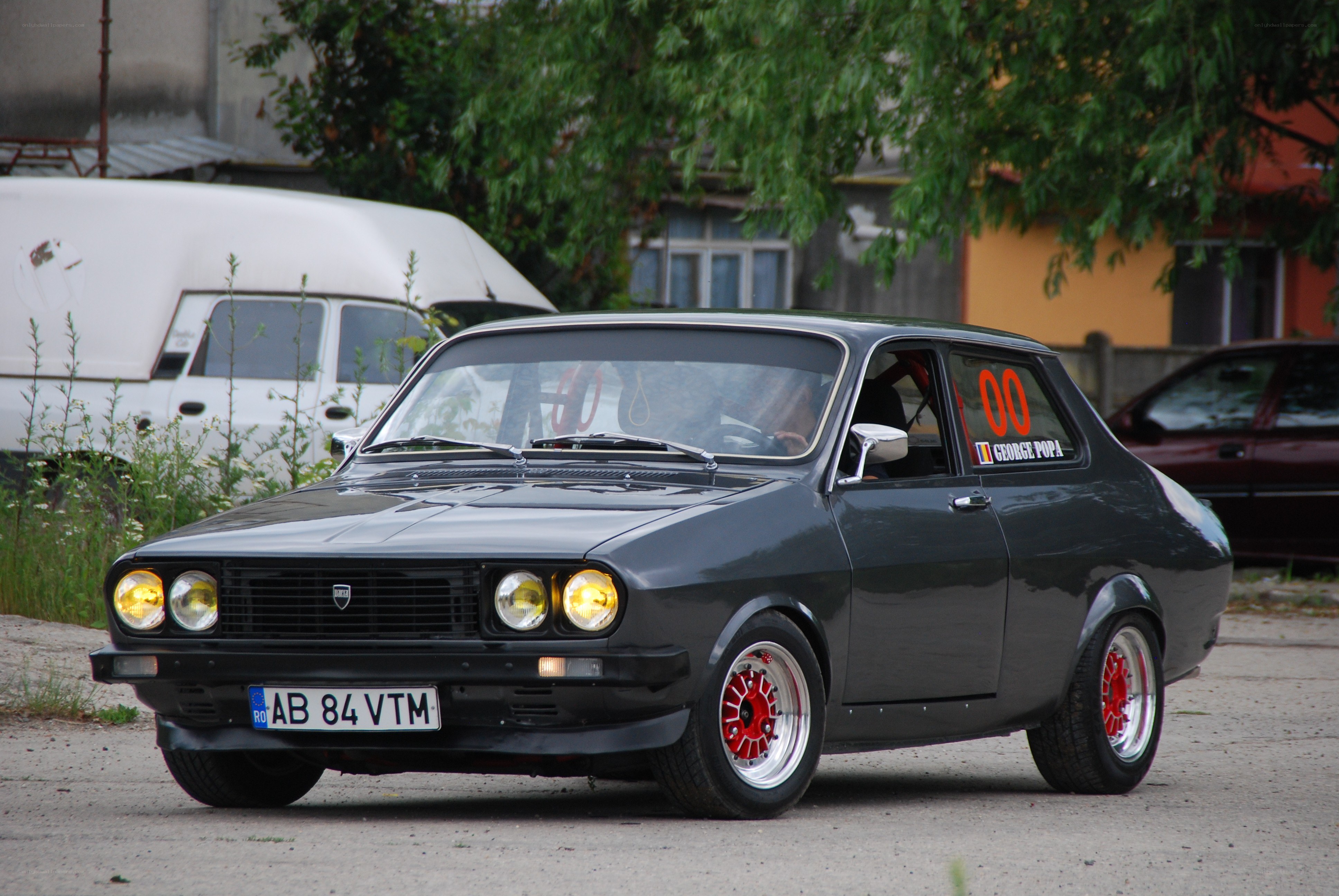 Black Dacia with red wheels