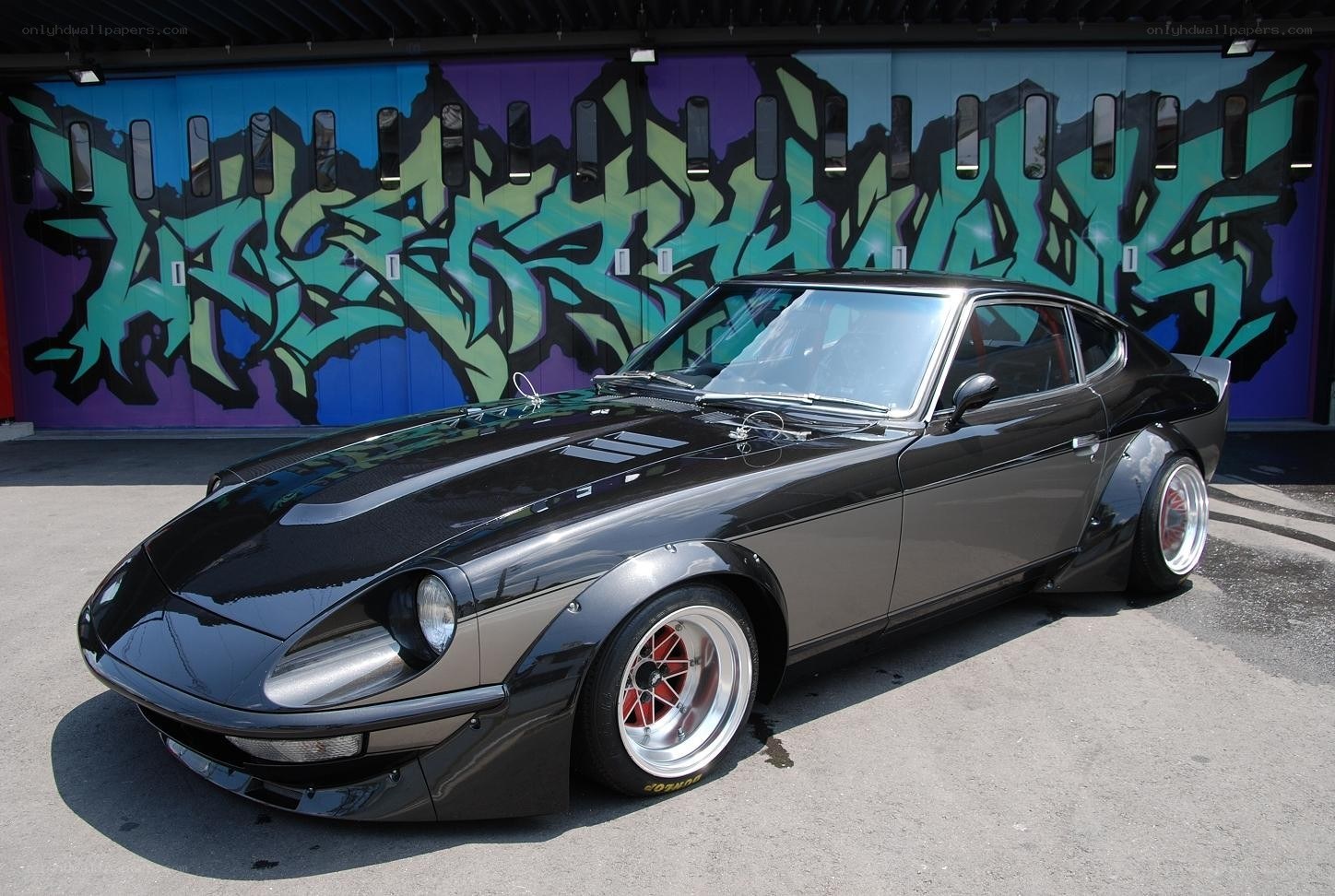 Black Datsun 240Z with custom wheels