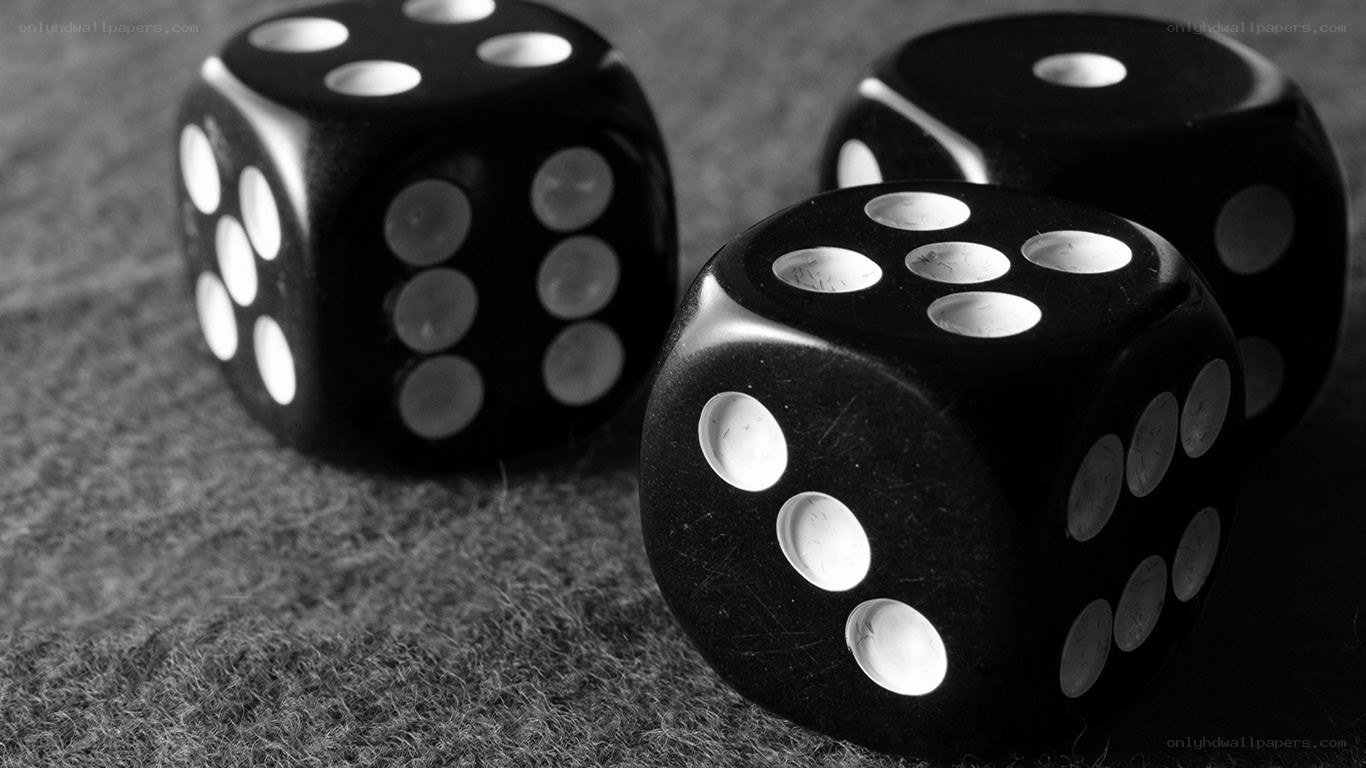 Black dice on a textured surface