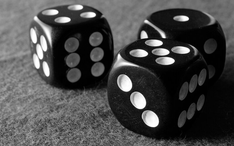 black dice on felt surface
