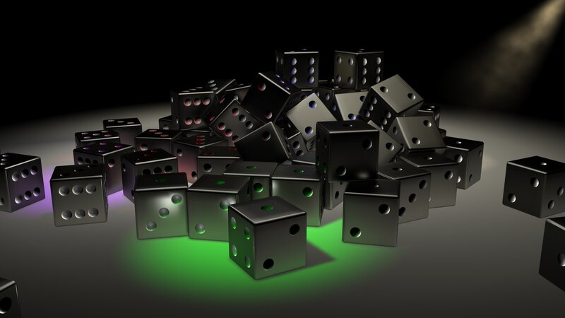 black dice pile under spotlights