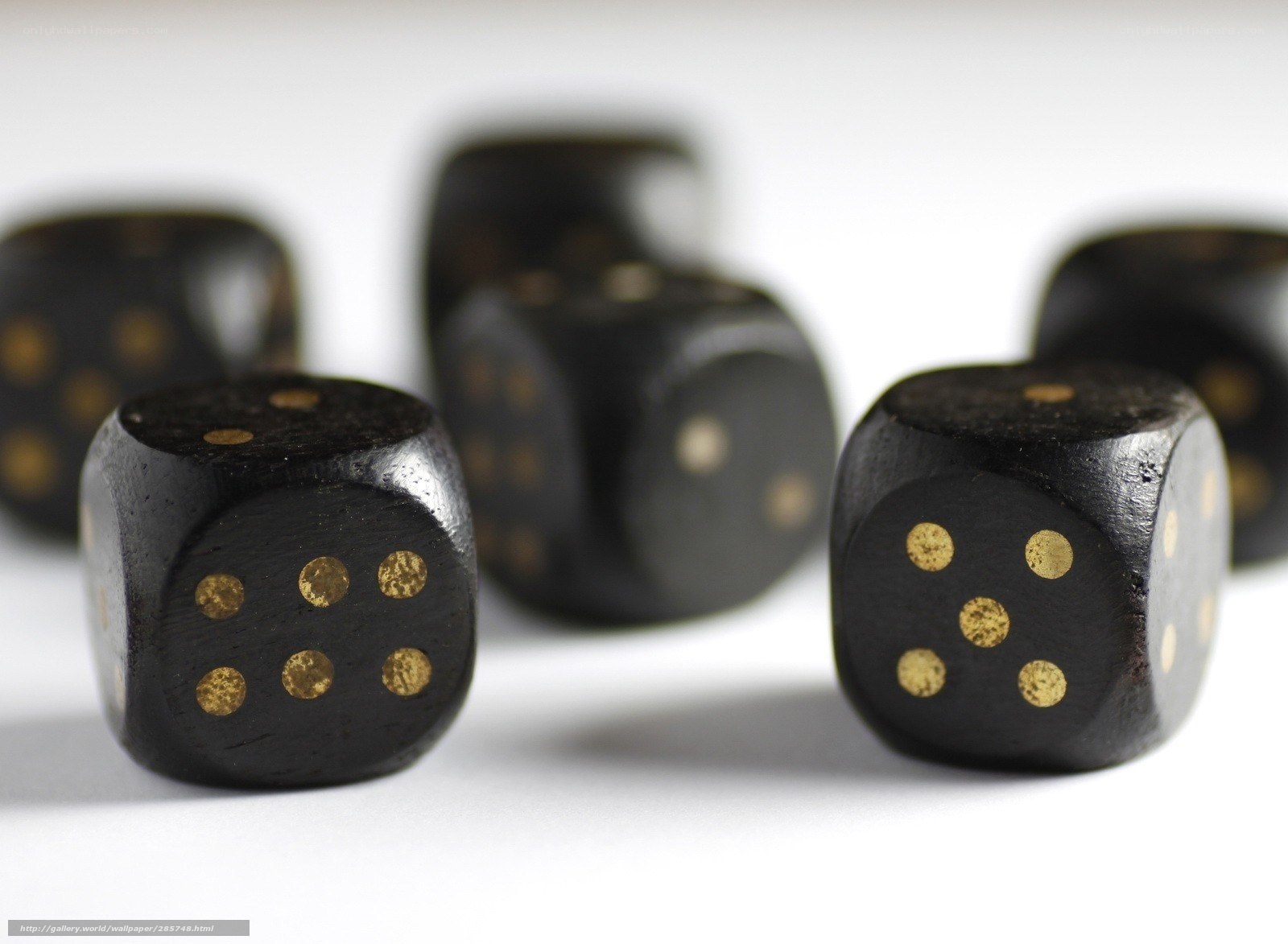 black dice with gold dots