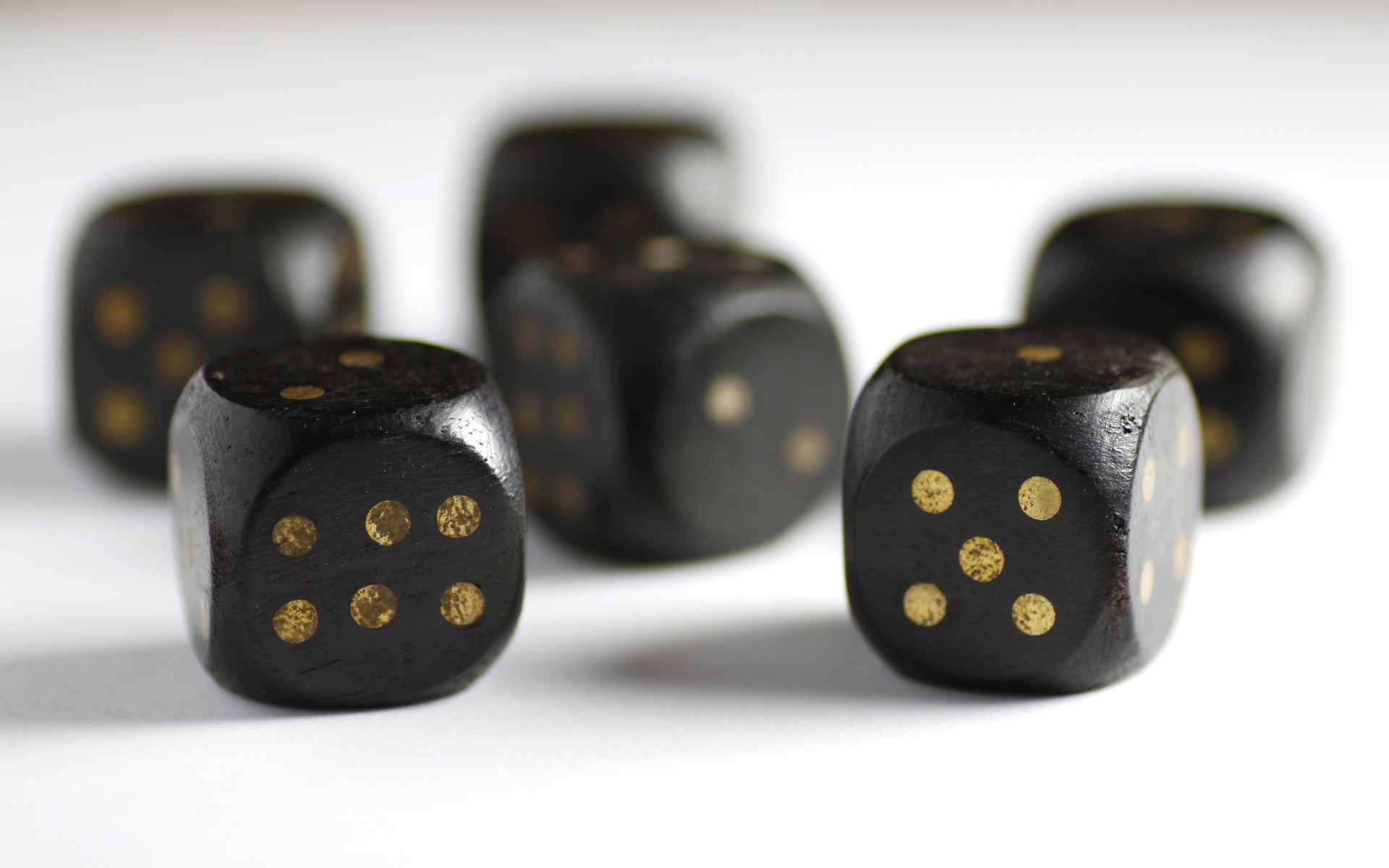 black dice with gold dots