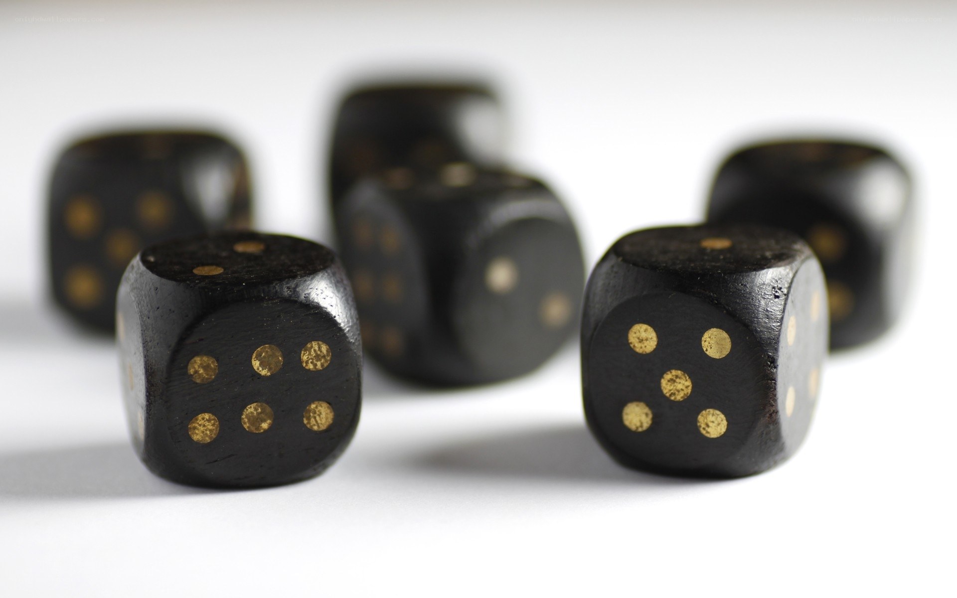 black dice with gold dots