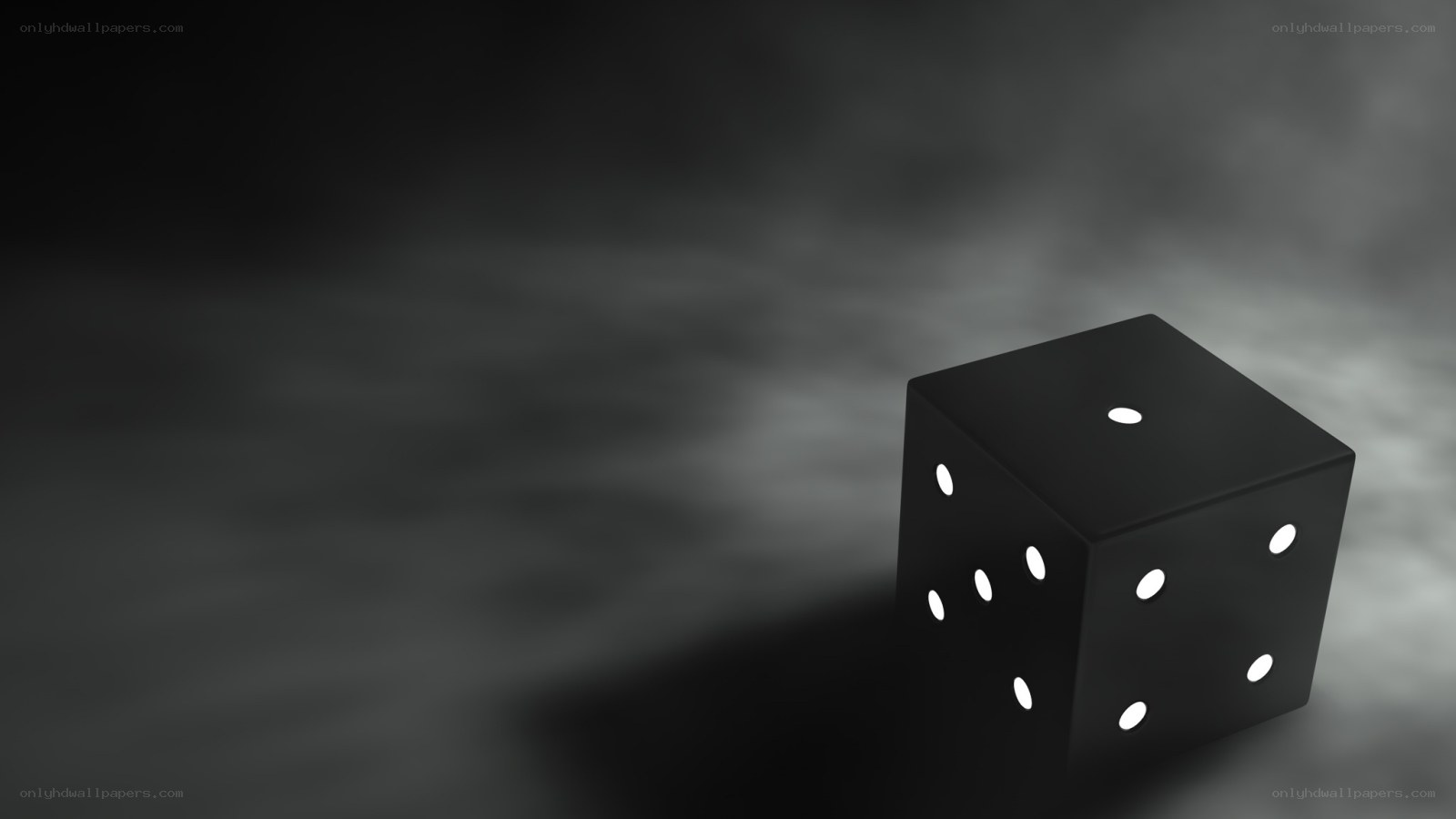 black die on dark background