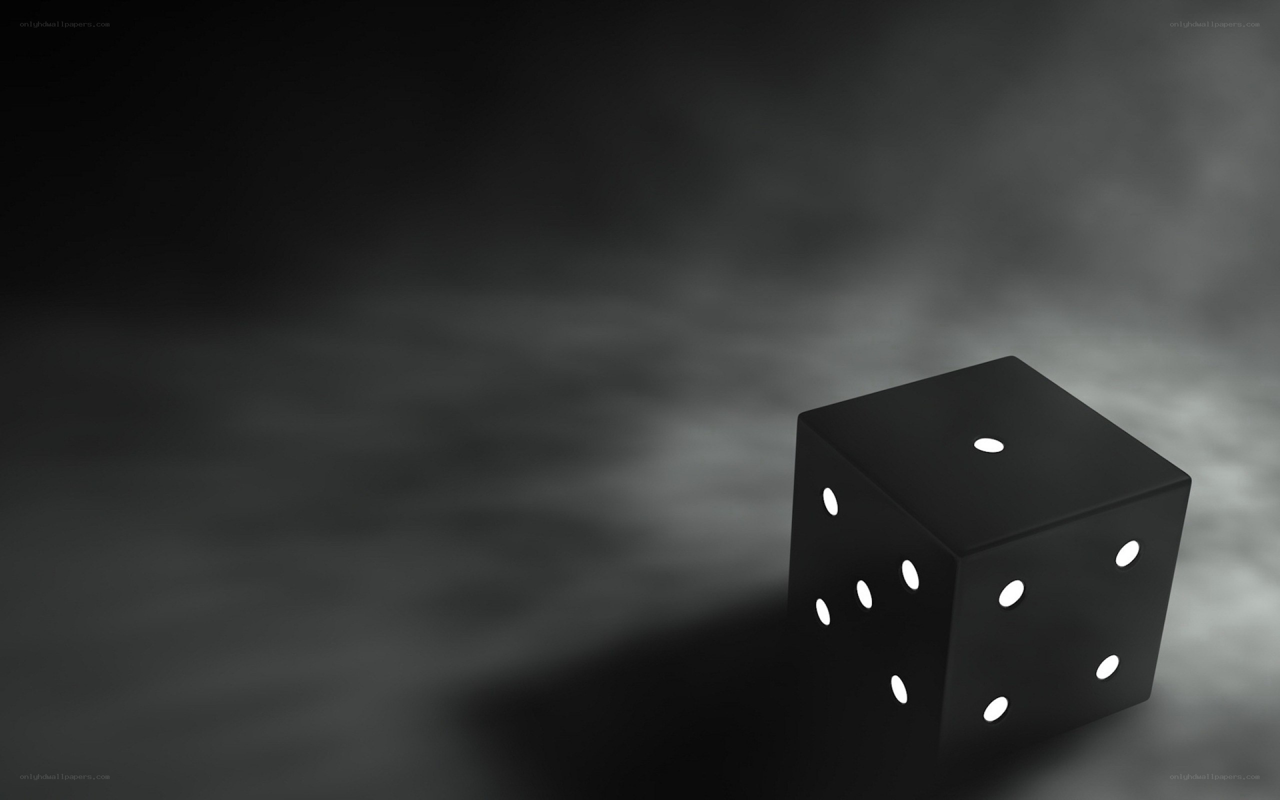 black die on dark background