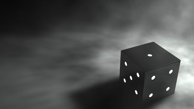 Black Die on Foggy Surface