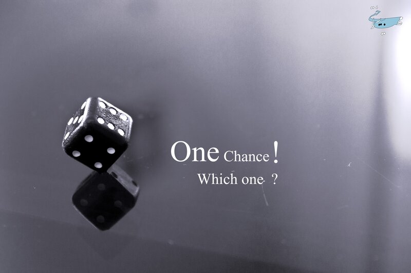 Black Die on Reflective Surface