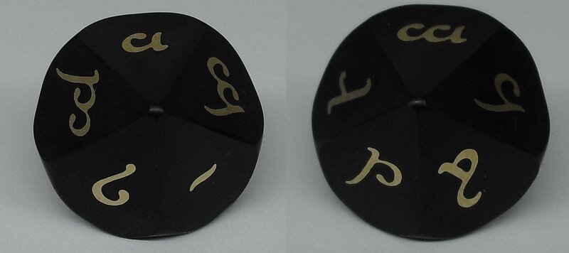 black die with gold symbols