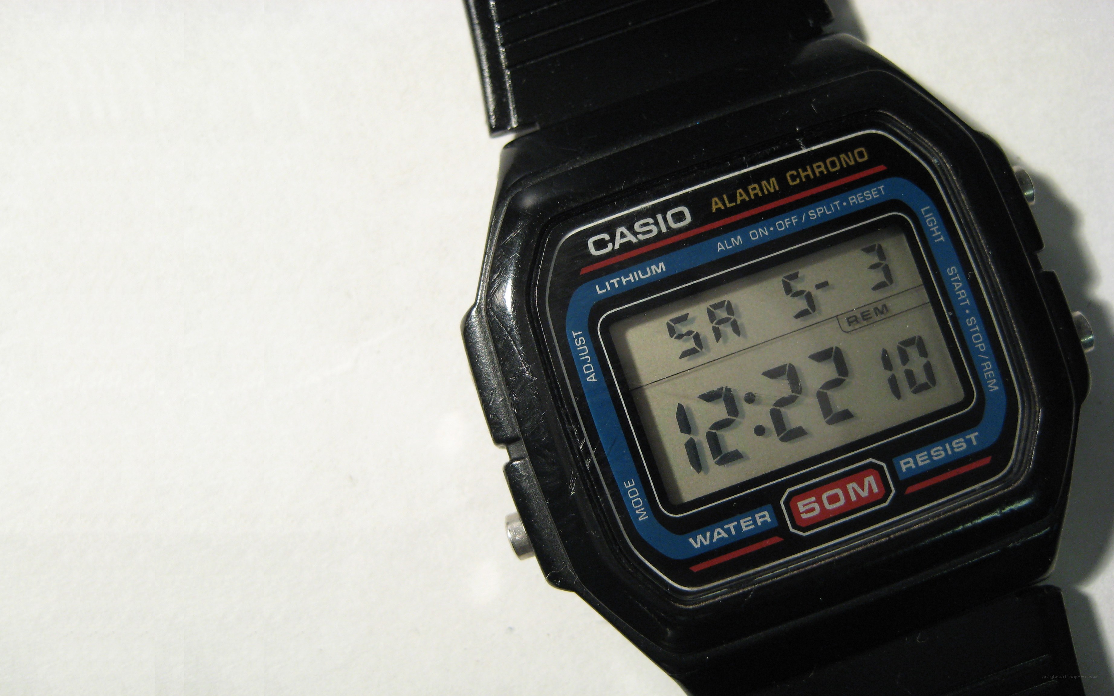 black digital watch on white