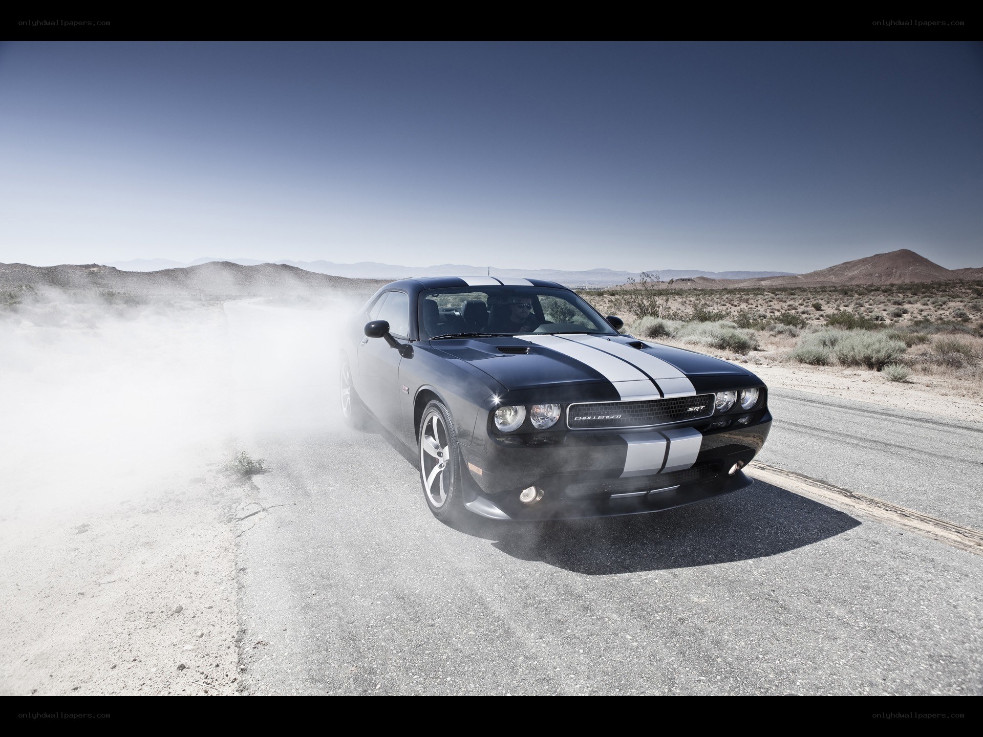 Black Dodge Challenger drifting