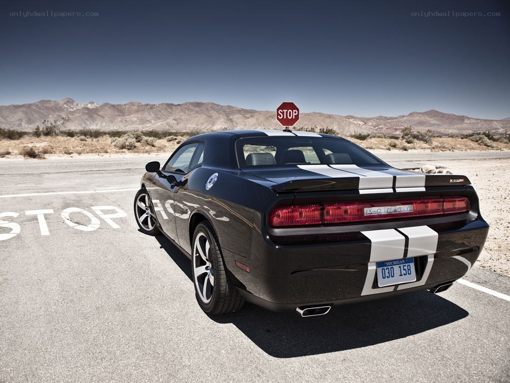 Black Dodge Challenger in desert