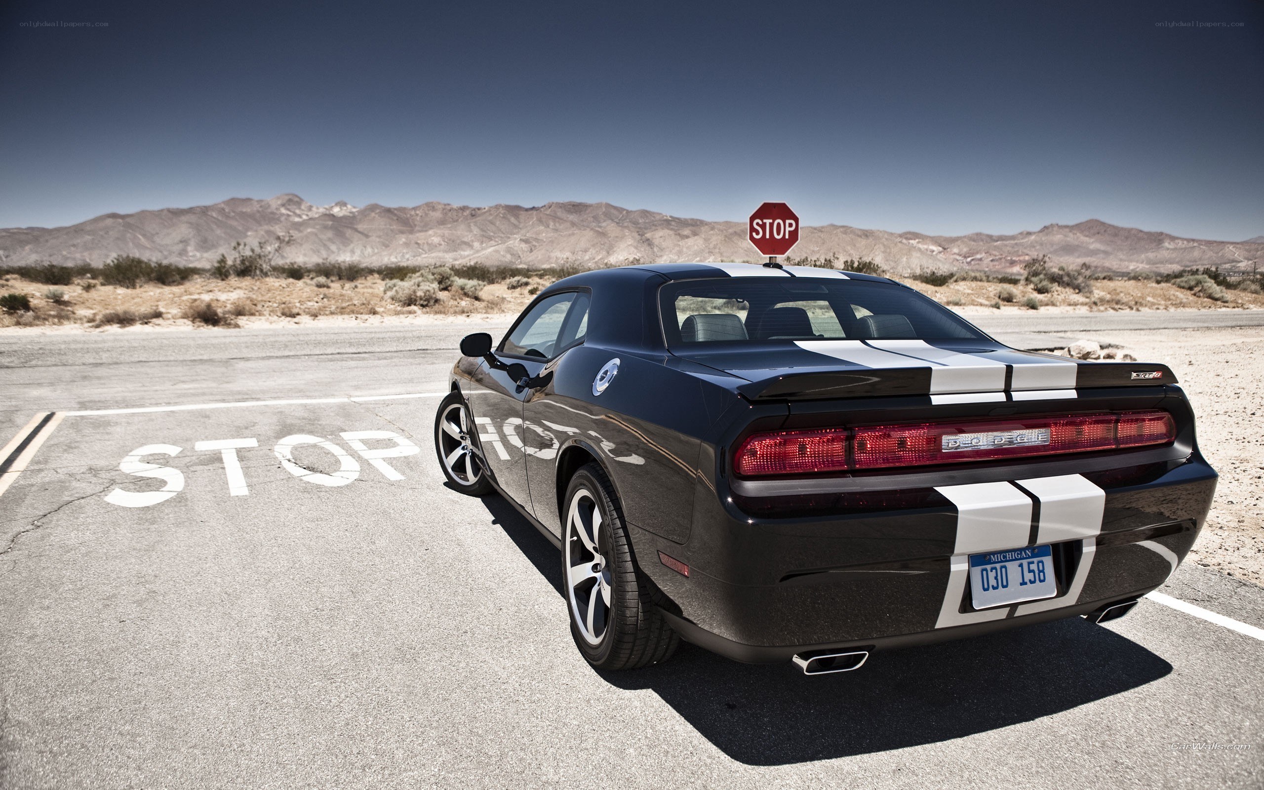 Black Dodge Challenger in desert