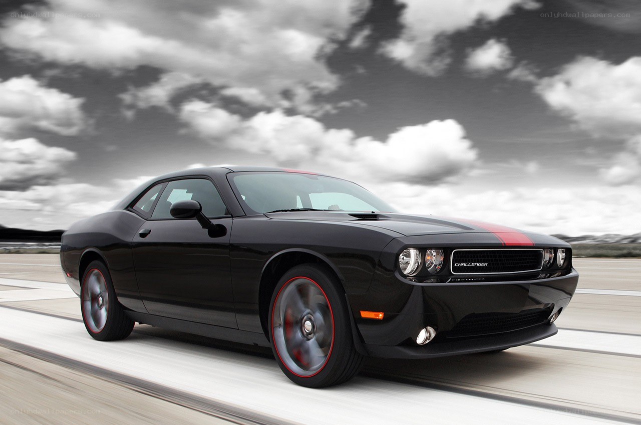 Black Dodge Challenger in motion
