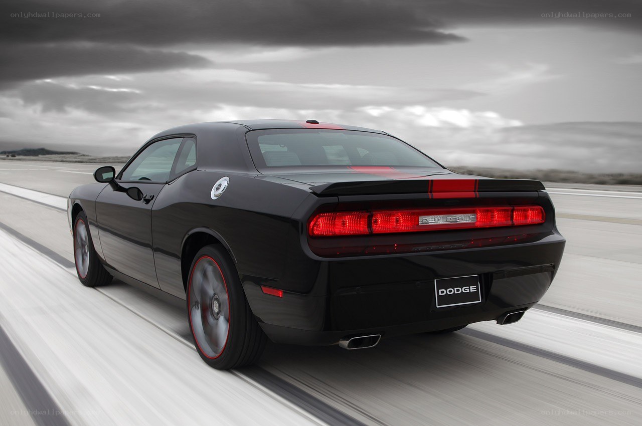 Black Dodge Challenger in motion