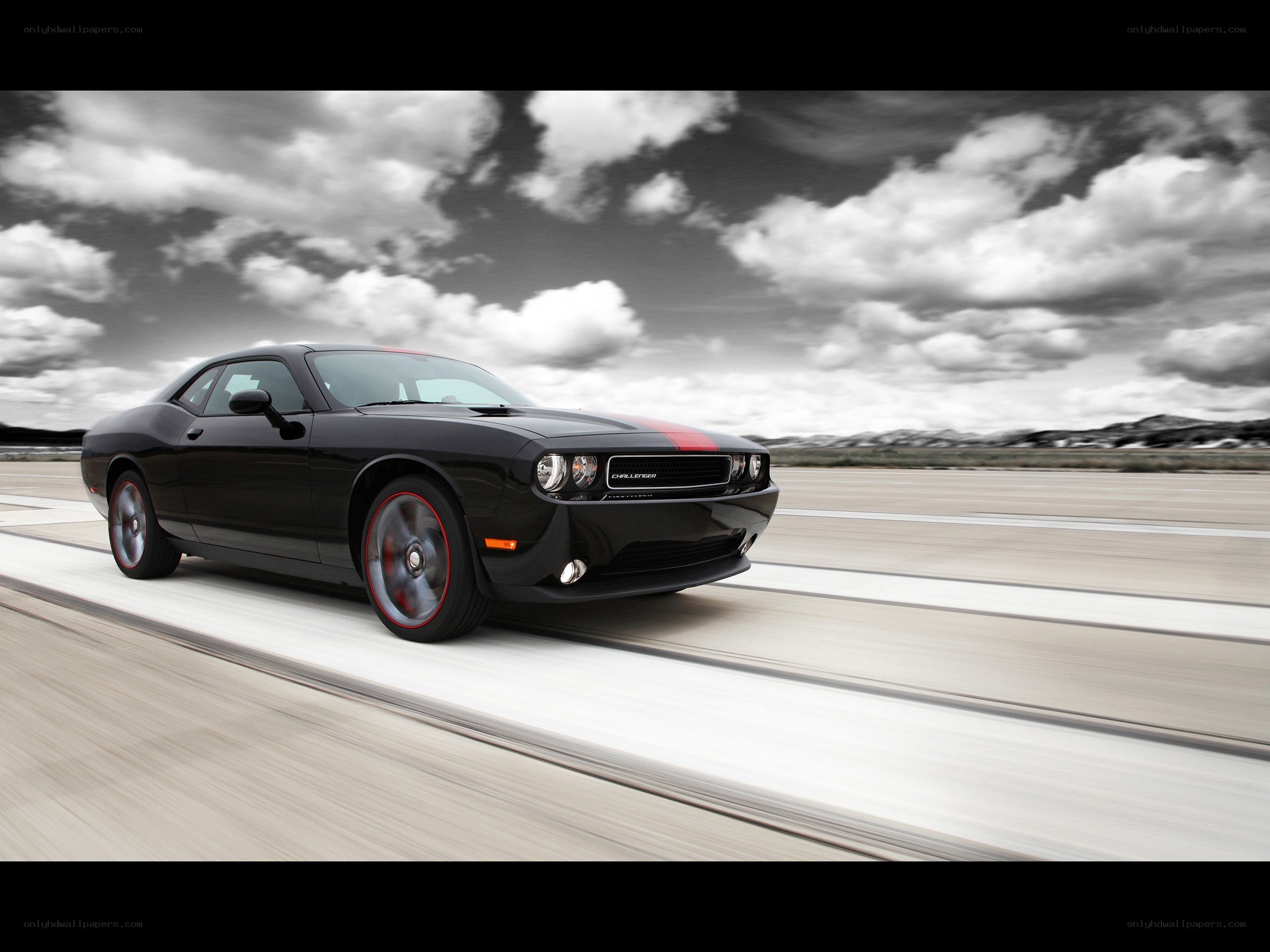 Black Dodge Challenger in motion