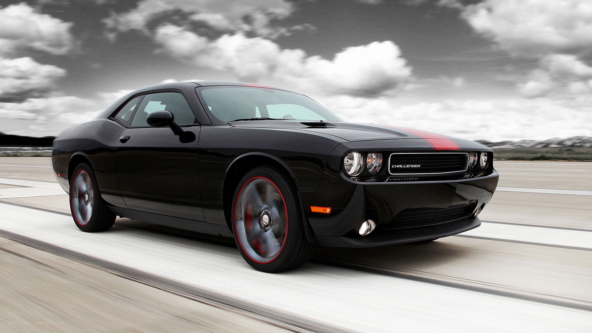 Black Dodge Challenger in motion