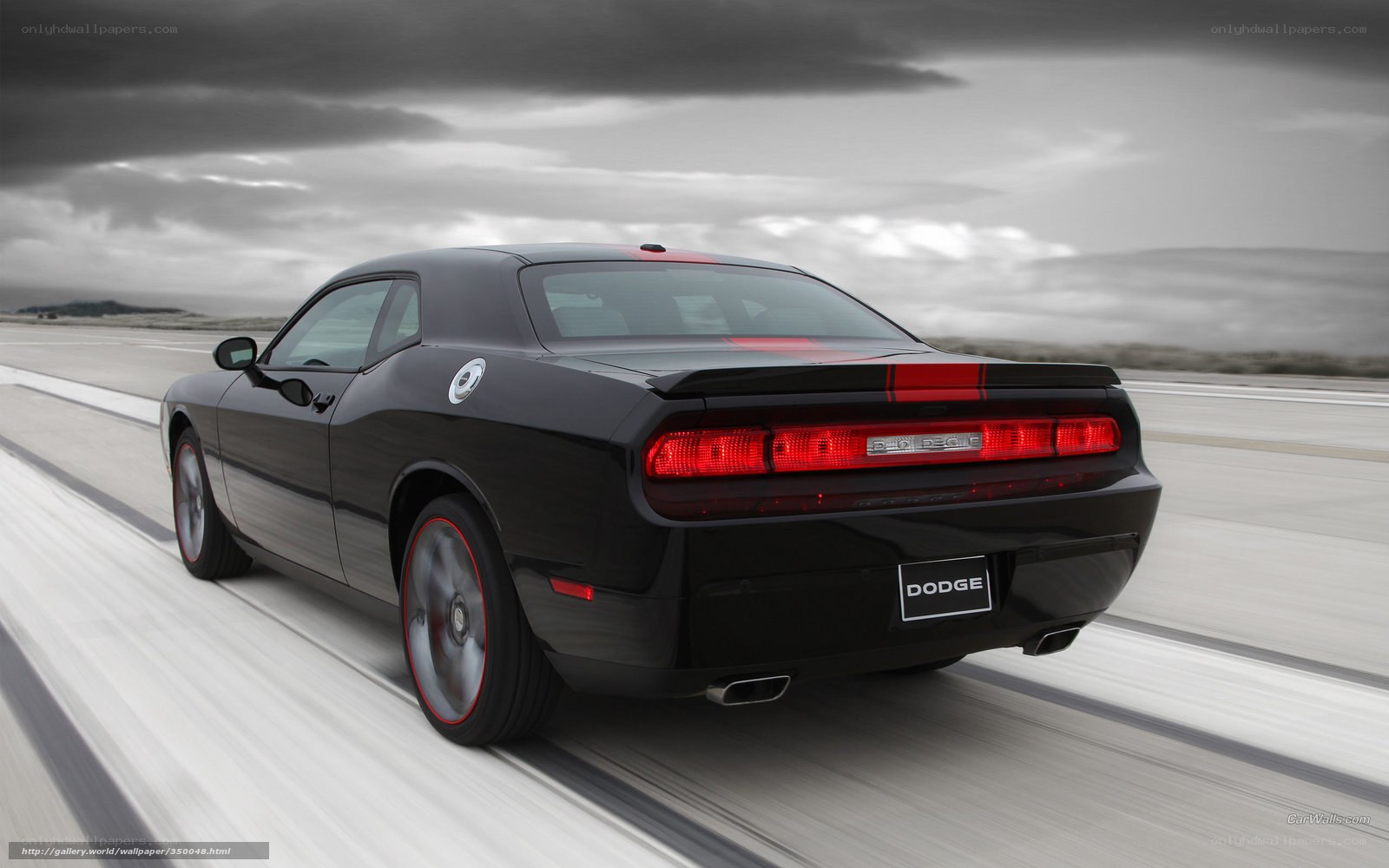 Black Dodge Challenger in motion