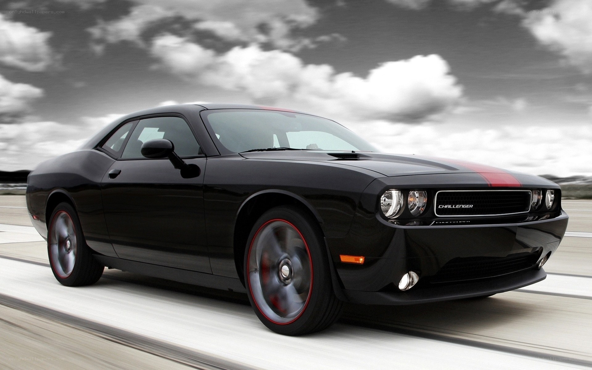 Black Dodge Challenger in motion