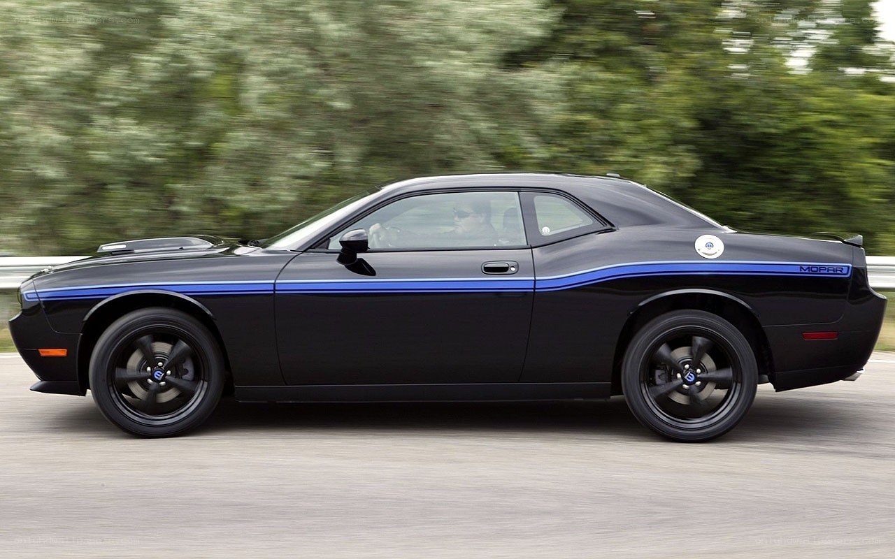 black dodge challenger in motion