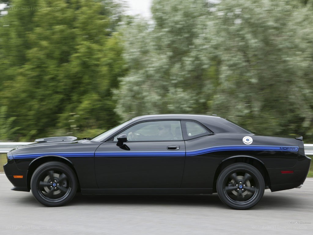 Black Dodge Challenger in motion