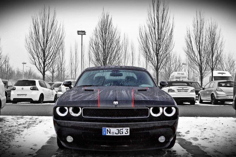 Black Dodge Challenger in parking lot
