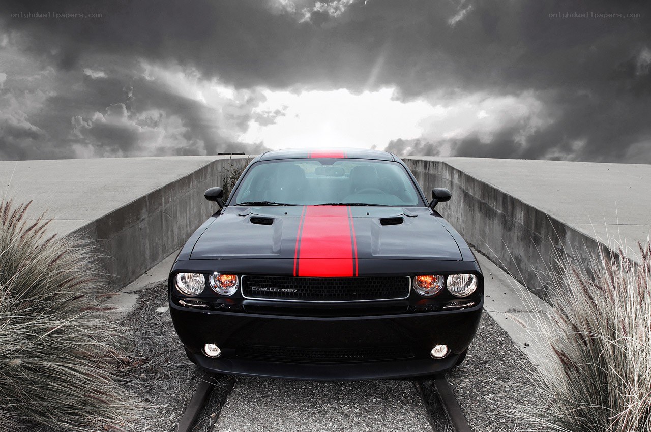 Black Dodge Challenger on a bridge
